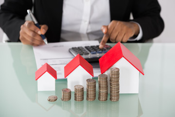 Businesswoman Calculating Invoice