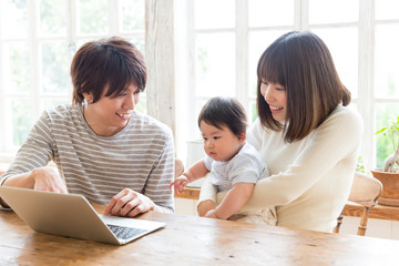 asian family using laptop