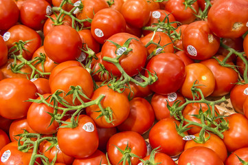 red tomato in market from market shelves real with flaws and bru