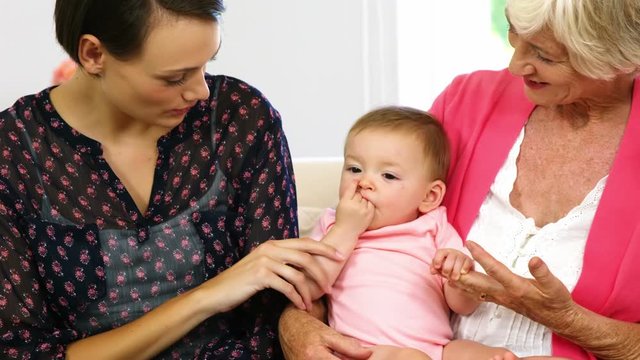 Happy family looking the baby