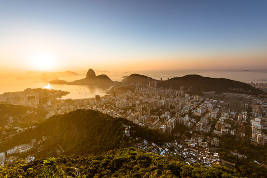 Golden Sunrise in Rio de Janeiro with Sugarloaf Mountain in the Horizon