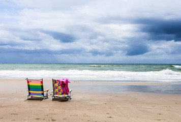 Fototapeta na wymiar Colorful Chairs at the beach