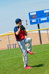 Youth baseball pitcher warming up before pitching. © tammykayphoto