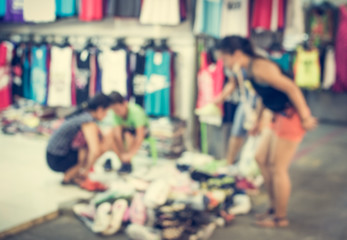 Blurred people are in the market