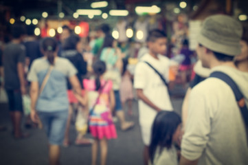 Blurred people are in the market