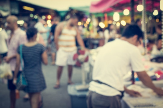 Blurred people are in the market