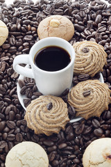 coffee in a mug with sugared cookies