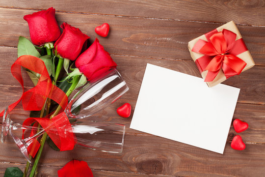 Valentines day greeting card, gift box and red roses