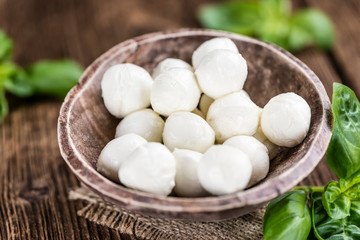 Mozzarella (on wooden background)