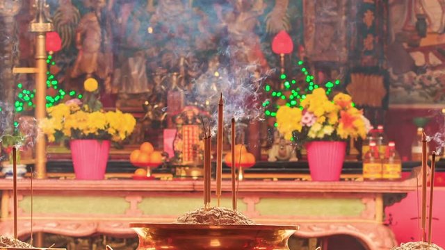 Burning Sticks in Bowls in Front of Altar in Indian Temple