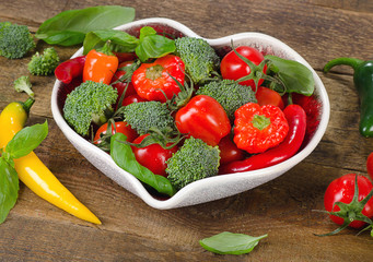 Vegetables in heart shape bowl.