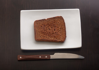 Toasted rye bread on the white plate