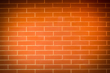 Old vintage orange red brick wall background. Texture pattern of red brick wall for wallpaper.