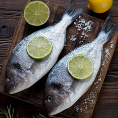 Close-up of raw fresh seasoned dorado, high angle view