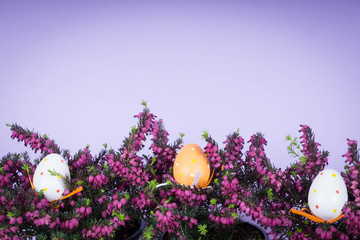 Fototapeta premium Easter decorations with heather, eggs and bunny