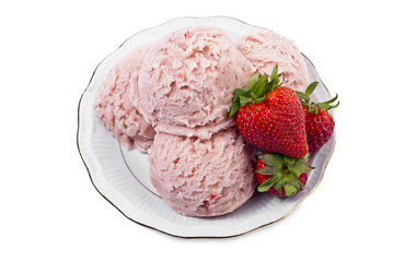 a scoop of strawberry ice cream with fruits on the side