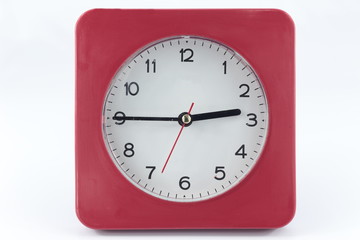 white and red wall small clock