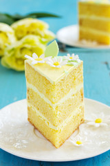 A piece of lemon sponge cake on a plate.