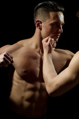 Fototapeta na wymiar Young muscular men boxing