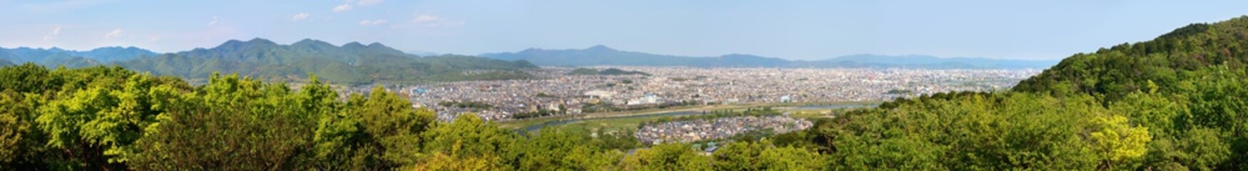 Fototapeta na wymiar Ultra wide panorama of Arashiyama and Kyoto city in Japan and the surrounding landscape and mountains