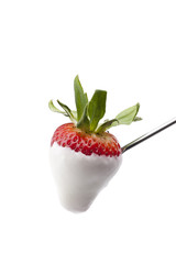 a fork with strawberry with white chocolate