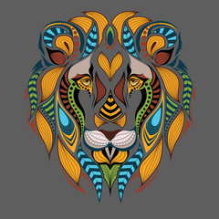 Patterned colored head of the lion. African / indian / totem / tattoo design. It may be used for design of a t-shirt, bag, postcard and poster.
