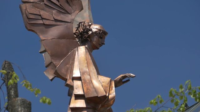 Portrait of an angel, made by metal, in contemporary sculpture style.
