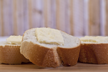 closeup baguette slices with butter