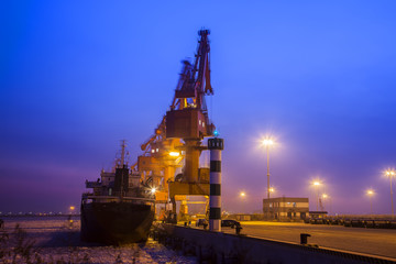 Cargo wharf crane at night