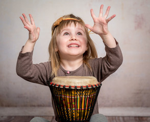 cute little girl playing drum