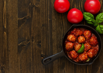 Homemade meatballs in tomato sauce.