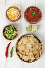 nacho chips with condiments