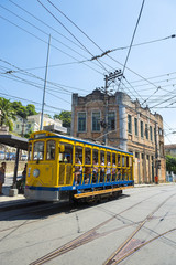 Fototapeta na wymiar Old-fashioned bonde tram travels the streets of Santa Teresa in Rio de Janeiro, Brazil 