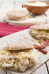 Sandwich with chickend and guacamole, cheese.