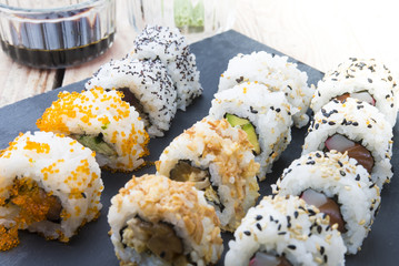 Sushi rolls on a slate plate