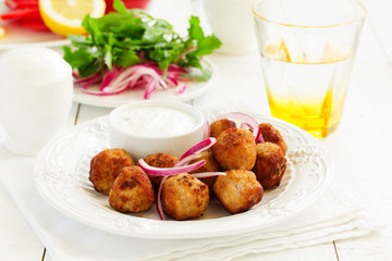Homemade meatballs with cream sauce.