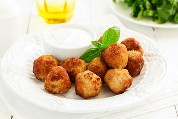 Homemade meatballs with cream sauce.