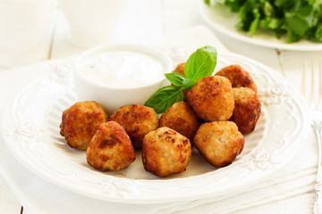 Homemade meatballs with cream sauce.