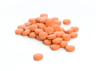 Obraz na płótnie Canvas orange pills. Isolated on a white background