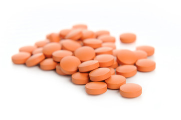 orange pills. Isolated on a white background