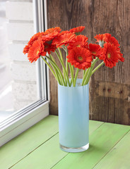Bouquet of orange gerbera flowers in a vase