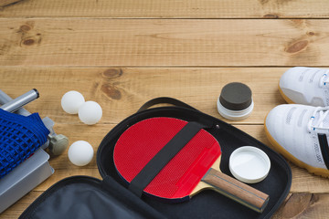 Table tennis paddle in open case with other mandatory equipment