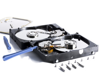 details of hard disk drive opened with evidence of the internal disk next to a cooling fan