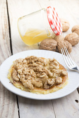 Pancakes with walnut and caramel for a breakfast