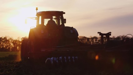 Tractor Silhouette, leave the setting sun - Powered by Adobe