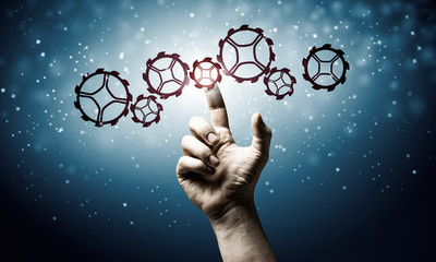 Cogwheel mechanism as teamwork concept