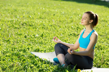 Woman meditating in park