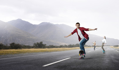 Fototapeta na wymiar Young people riding skateboard