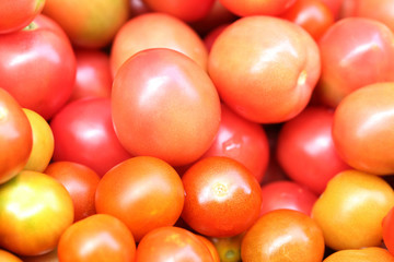 Background of red tomatoes, selective focus.