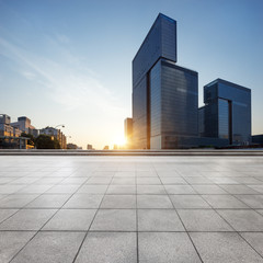 empty marble floor with cityscape and skyline at sunrise